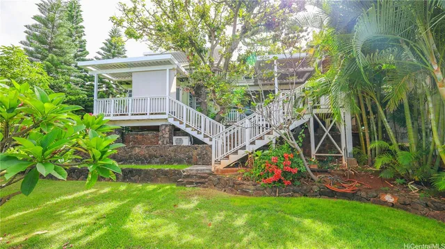 a view of a backyard with a garden and trees