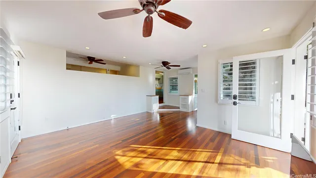 a room with wooden floor and window