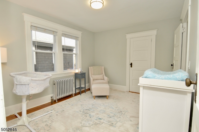 44 Dunnell Road Maplewood, NJ 07040 - Photo 11 of 18 a bedroom with furniture and a window