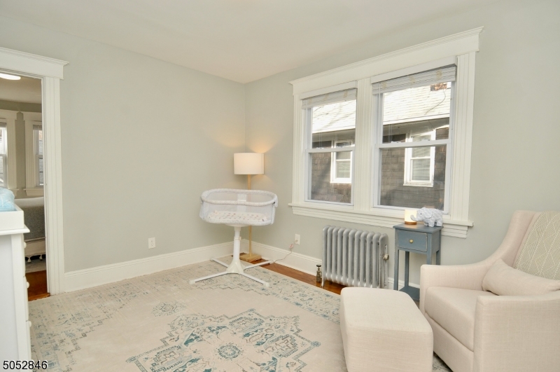 44 Dunnell Road Maplewood, NJ 07040 - Photo 12 of 18 a view of a livingroom with furniture and windows