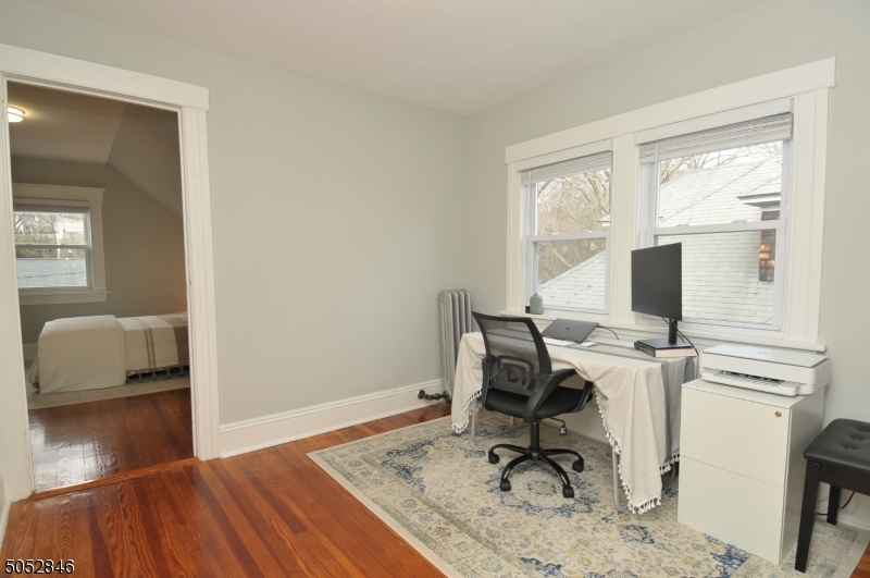 44 Dunnell Road Maplewood, NJ 07040 - Photo 16 of 18 a workspace with furniture and a window