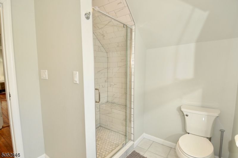 44 Dunnell Road Maplewood, NJ 07040 - Photo 18 of 18 a white toilet sitting next to a bathroom sink