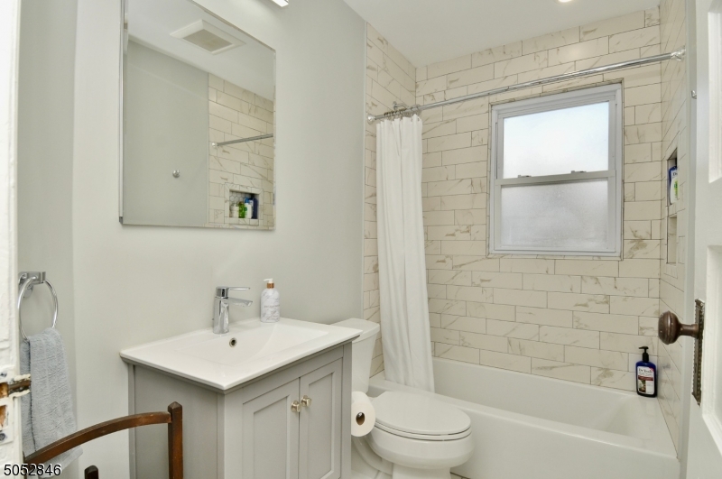 44 Dunnell Road Maplewood, NJ 07040 - Photo 10 of 18 a bathroom with a sink toilet and shower