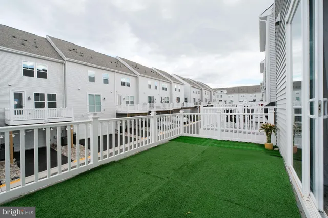 a view of a house with backyard and porch