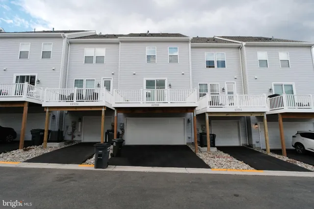 a front view of a building with many windows