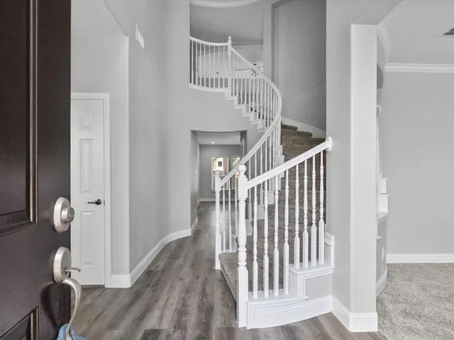 a view of entryway with wooden floor