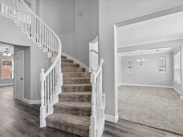 a view of an entryway with wooden floor