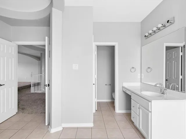 a bathroom with a bathtub and a sink