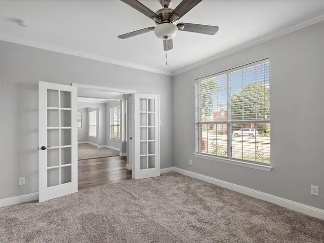 a view of an empty room with a window