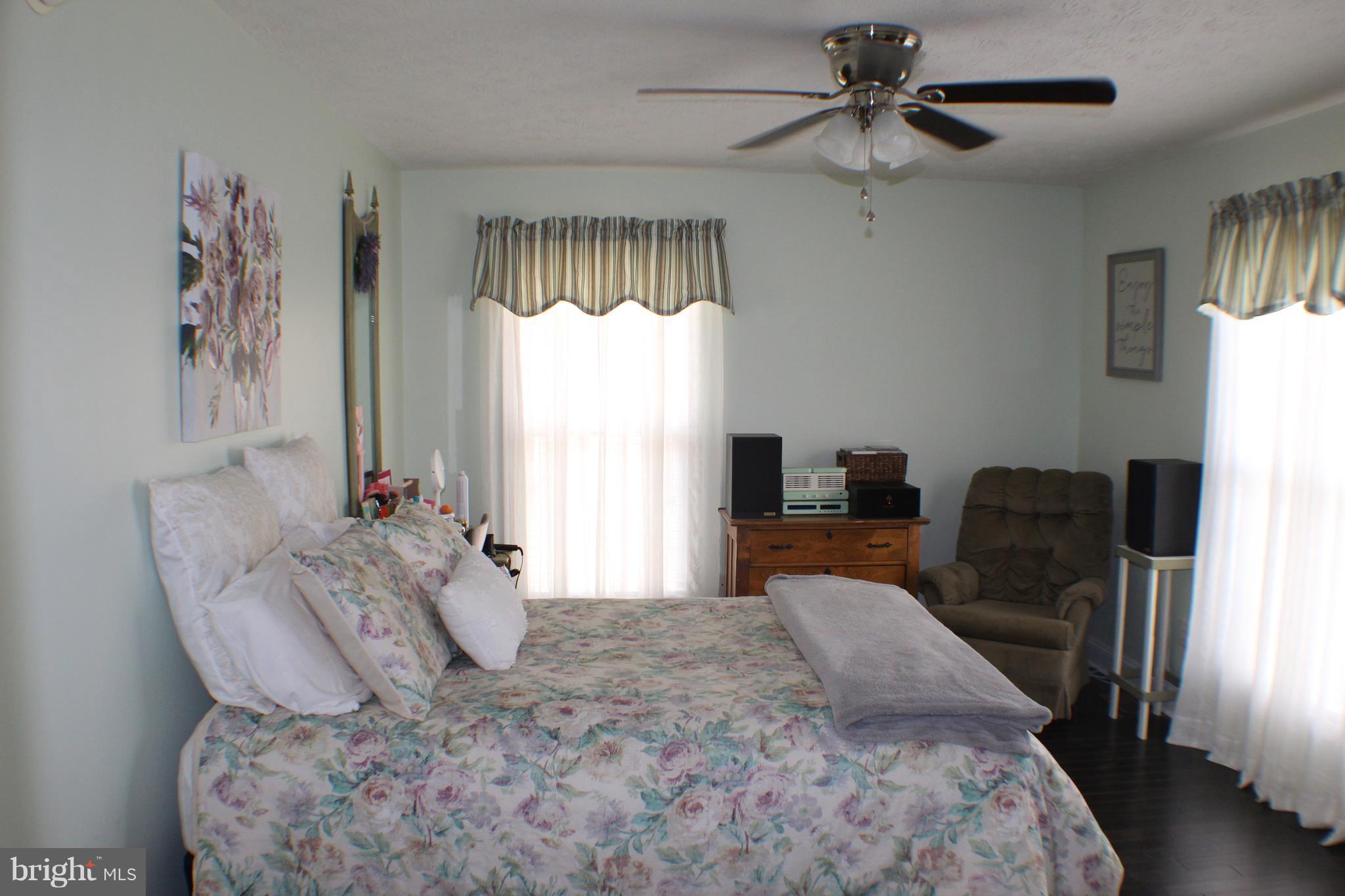3307 Cabin Road Reva, VA 22735 - Photo 12 of 30 a bed sitting in a bedroom next to a window