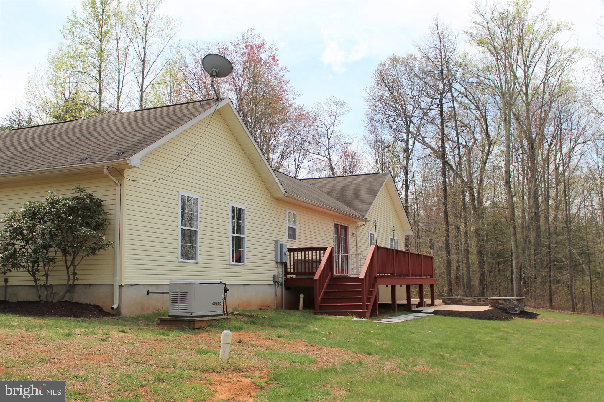 3307 Cabin Road Reva, VA 22735 - Photo 25 of 30 a backyard of a house with table and chairs