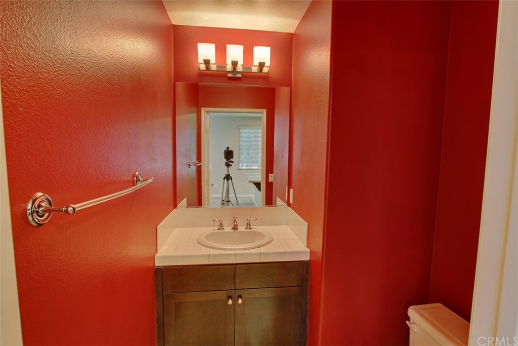 16073 Gables Loop Whittier, CA 90603 - Photo 12 of 31 a bathroom with a sink and a mirror