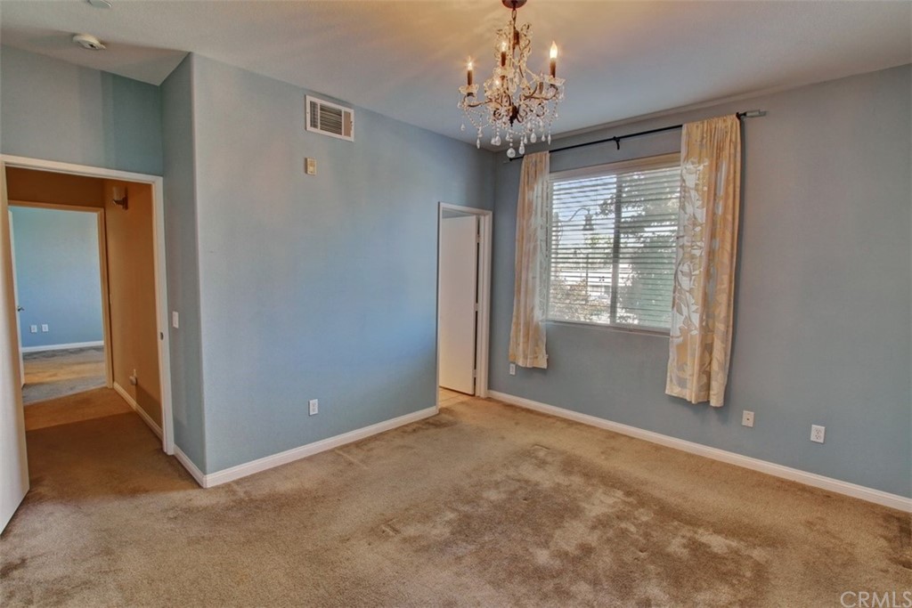 16073 Gables Loop Whittier, CA 90603 - Photo 16 of 31 a view of a big room with windows and chandelier