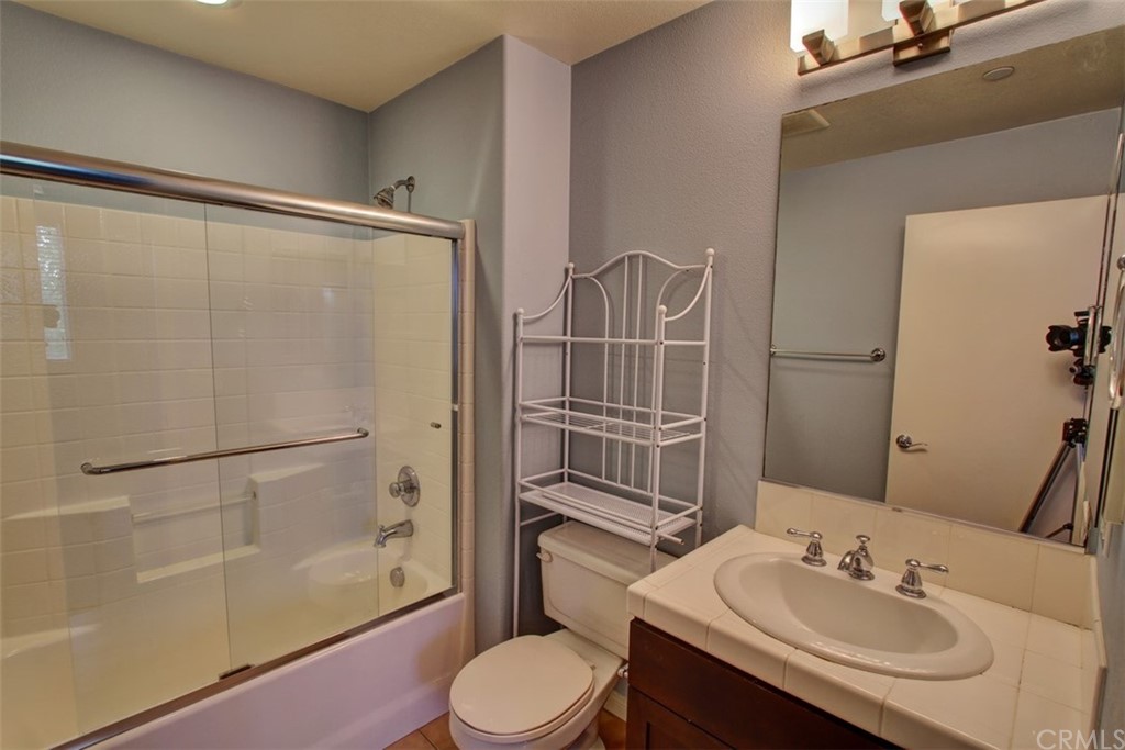 16073 Gables Loop Whittier, CA 90603 - Photo 21 of 31 a bathroom with a sink toilet and shower