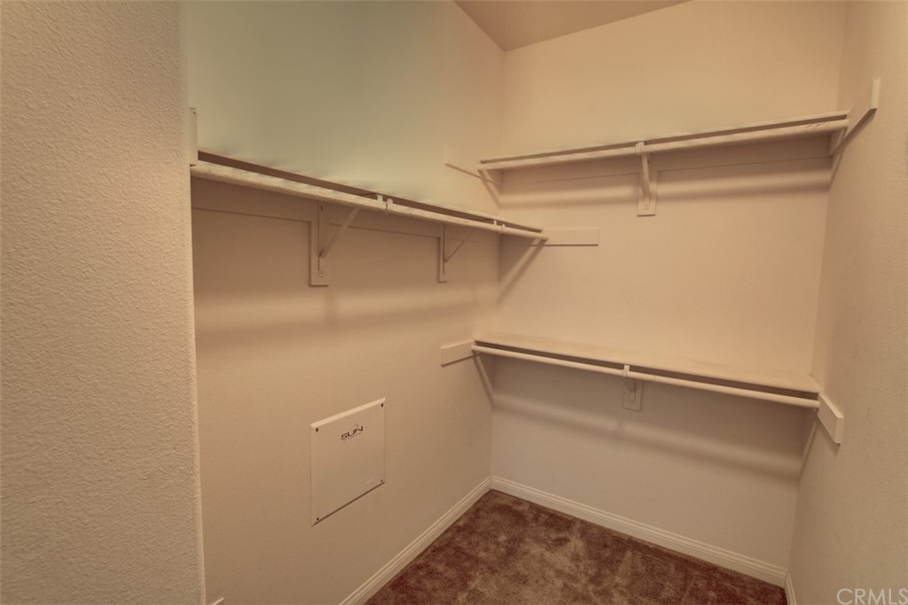 16073 Gables Loop Whittier, CA 90603 - Photo 22 of 31 a view of a room with racks on the wall