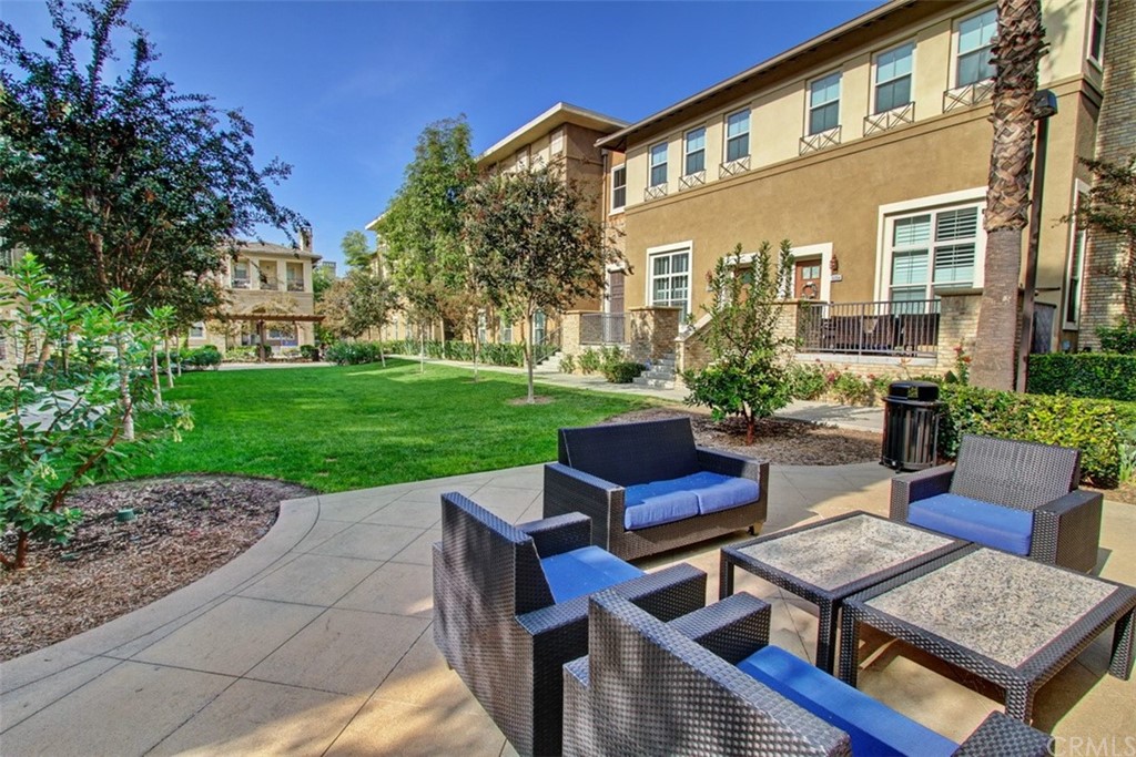 16073 Gables Loop Whittier, CA 90603 - Photo 30 of 31 a view of a patio with couches table and chairs and potted plants