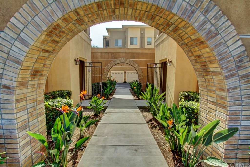 16073 Gables Loop Whittier, CA 90603 - Photo 3 of 31 a view of a brick house with potted plants
