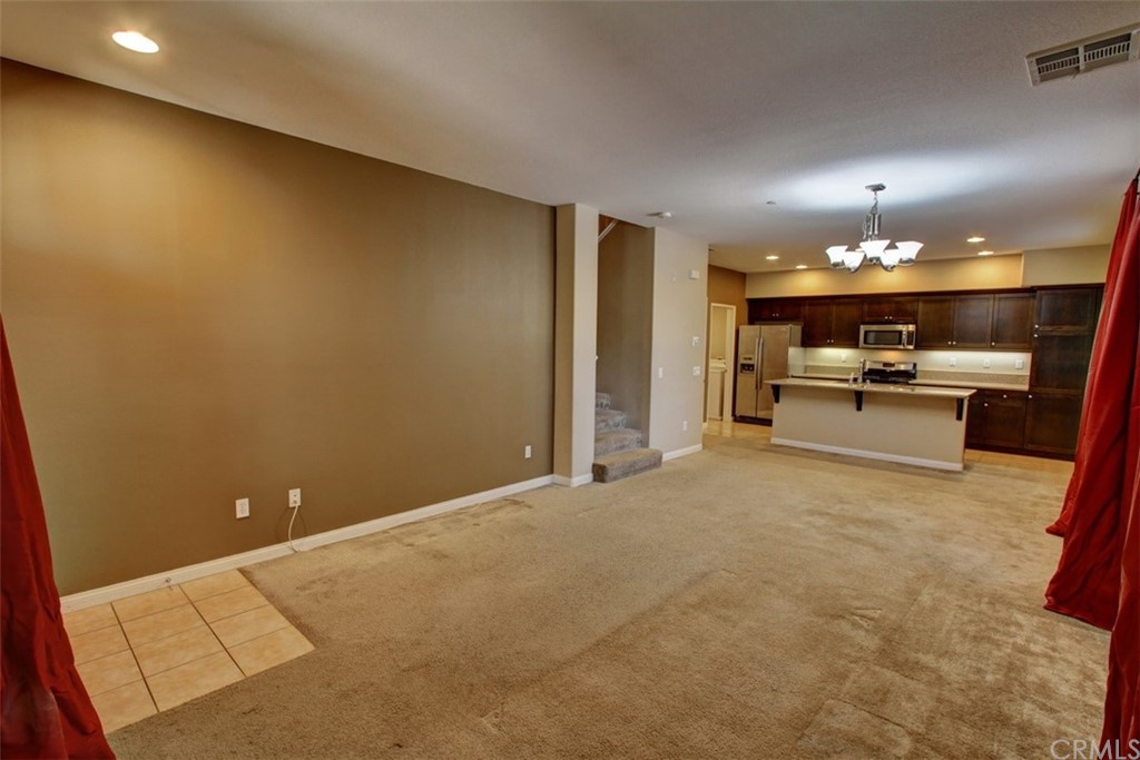 16073 Gables Loop Whittier, CA 90603 - Photo 7 of 31 a view of a livingroom with kitchen and a window