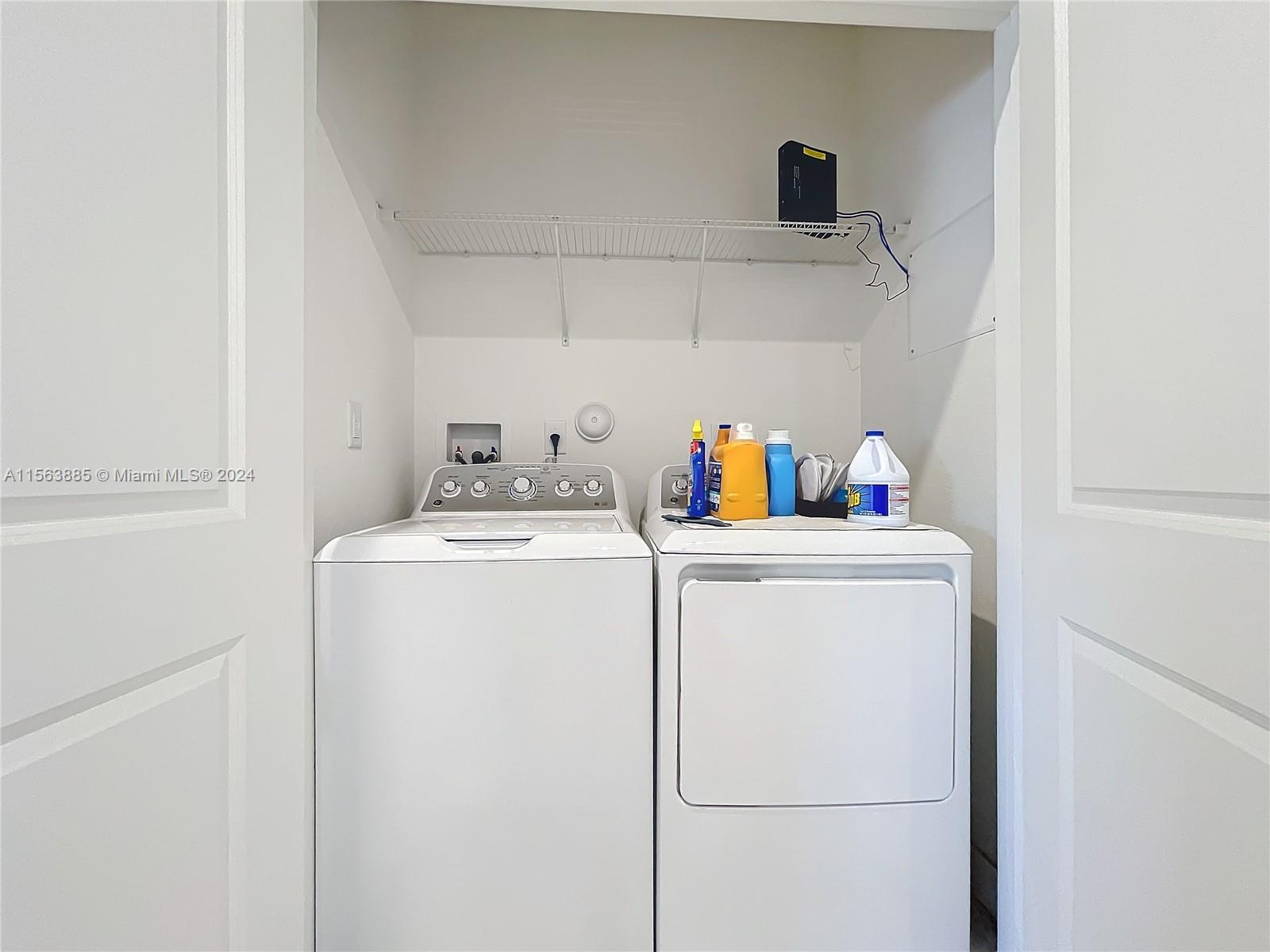 10888 Southwest 235th Lane Homestead, FL 33032 - Photo 20 of 36 a utility room with dryer and washer