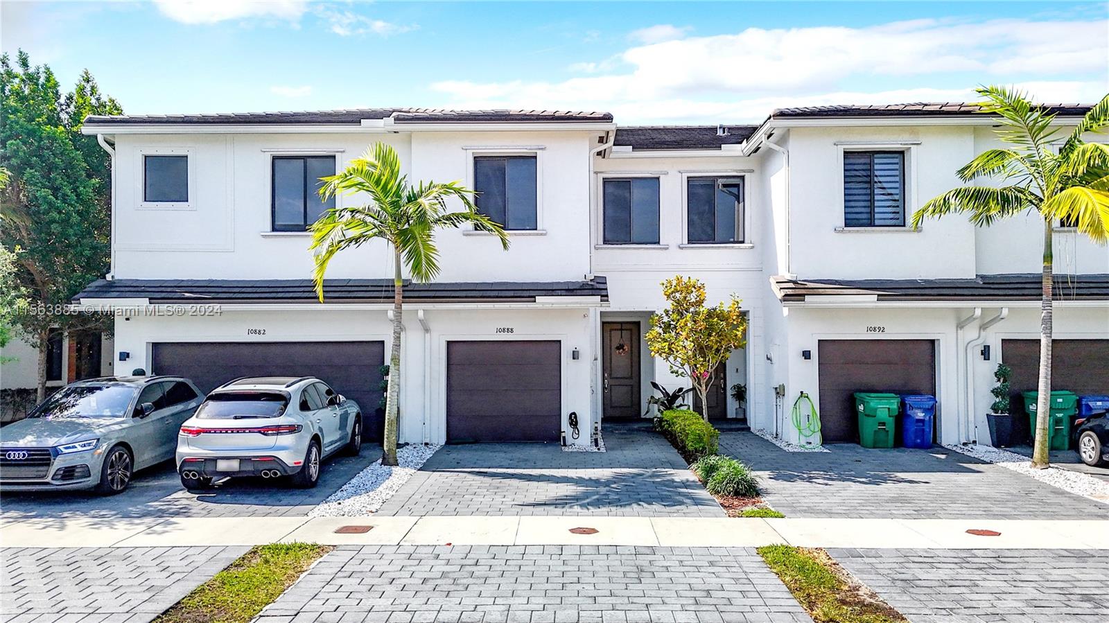 10888 Southwest 235th Lane Homestead, FL 33032 - Photo 2 of 36 a front view of a house with garden