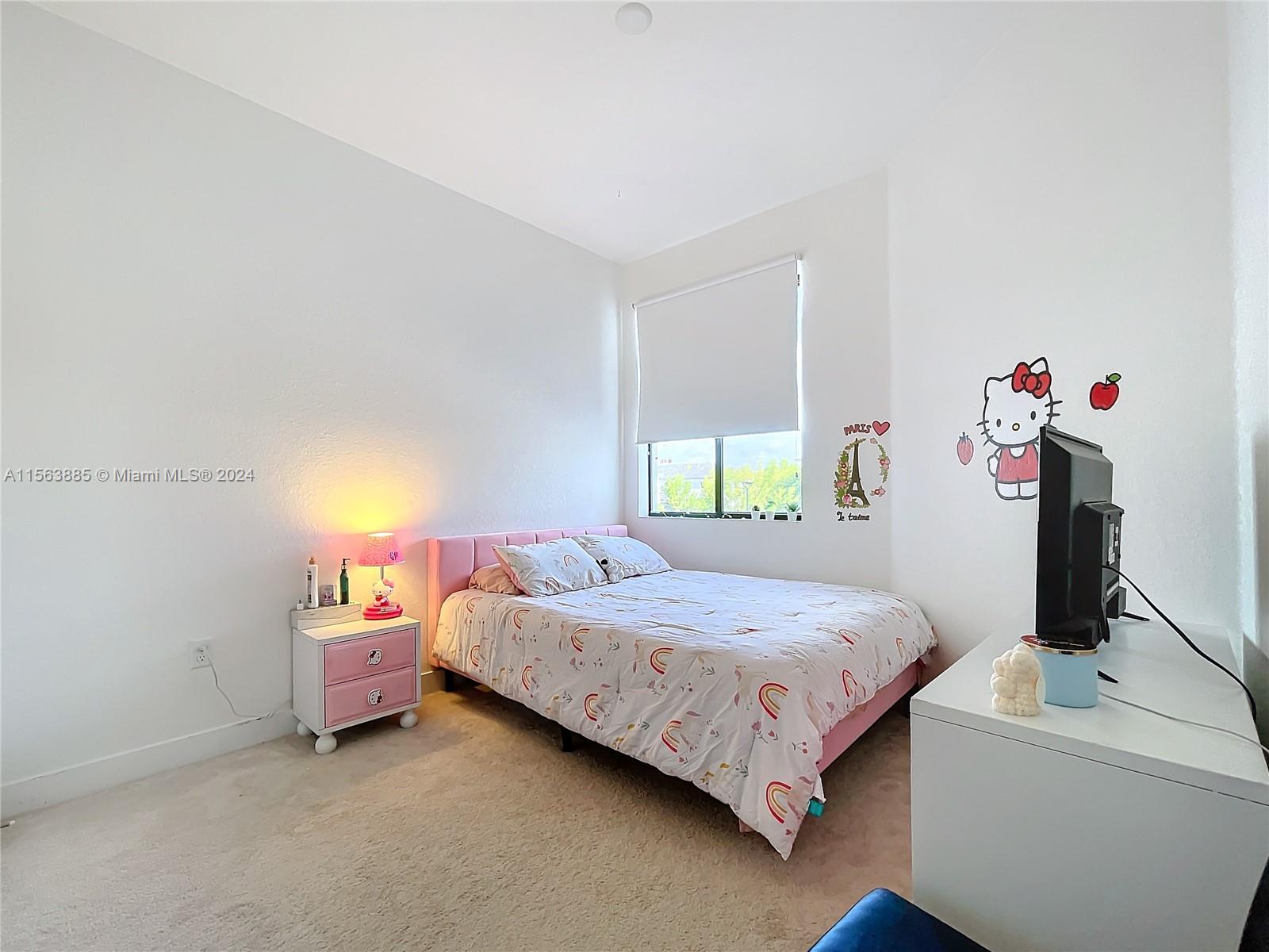 10888 Southwest 235th Lane Homestead, FL 33032 - Photo 21 of 36 a bedroom with a bed and a window