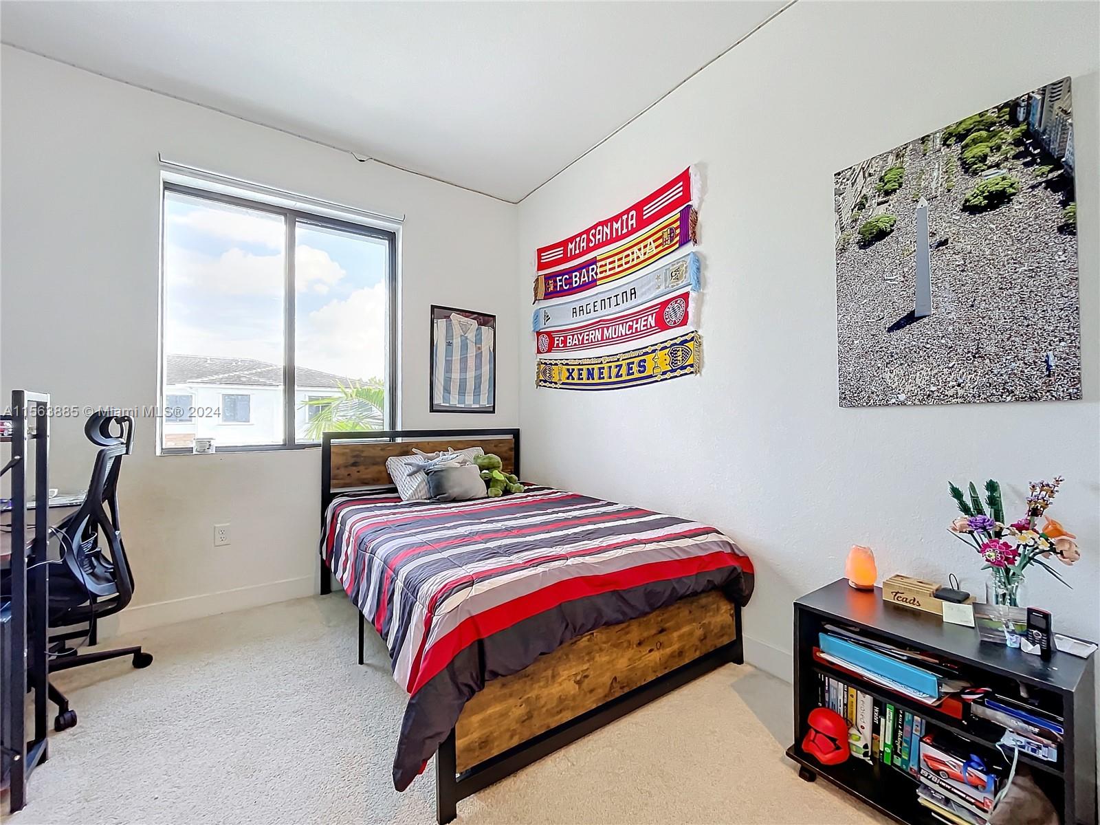 10888 Southwest 235th Lane Homestead, FL 33032 - Photo 23 of 36 a bedroom with bed and a window