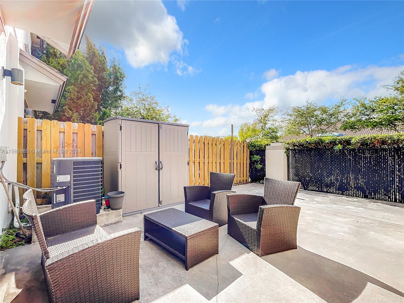 10888 Southwest 235th Lane Homestead, FL 33032 - Photo 28 of 36 a building outdoor space with patio furniture