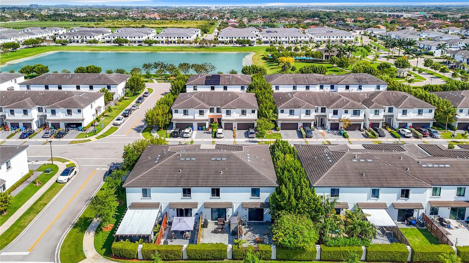 10888 Southwest 235th Lane Homestead, FL 33032 - Photo 4 of 36 an aerial view of residential houses and lake view