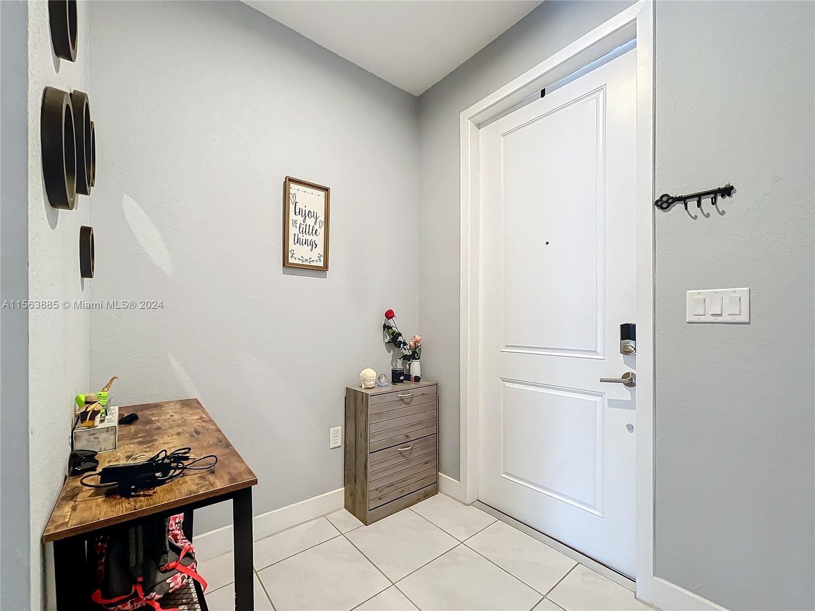 10888 Southwest 235th Lane Homestead, FL 33032 - Photo 9 of 36 a view of a hallway with seating area