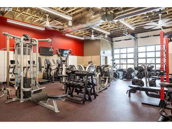 a outdoor dining space with furniture and white walls