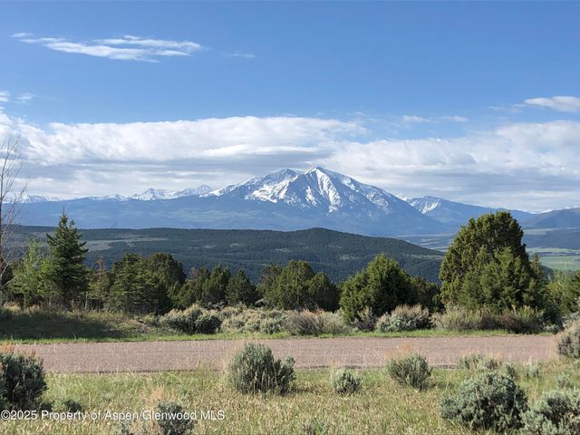 a view of lake with houses in the back