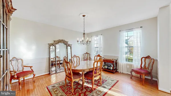 a living room with furniture a rug and a window