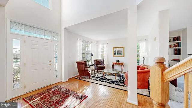 a living room with furniture and a lamp