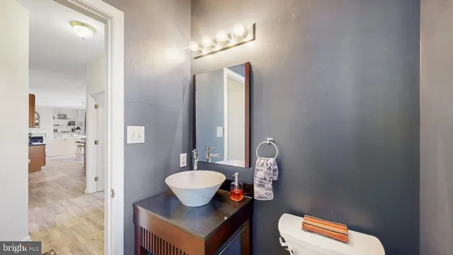 a bathroom with a double vanity sink mirror and shower