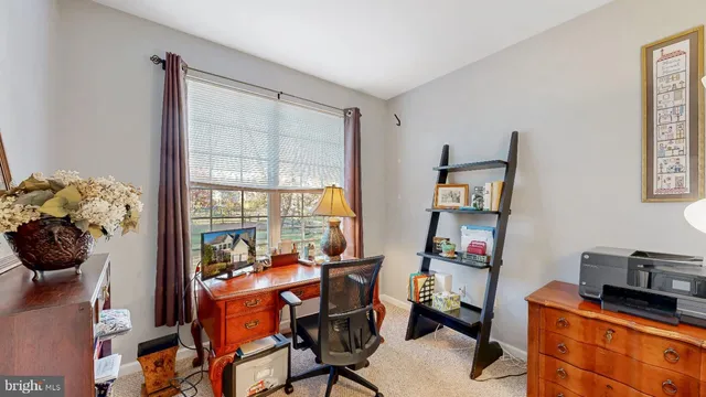a bathroom with a sink mirror vanity and toilet