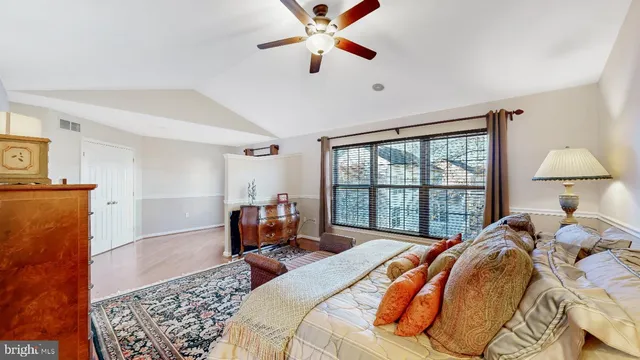 a view of an empty room and wooden floor
