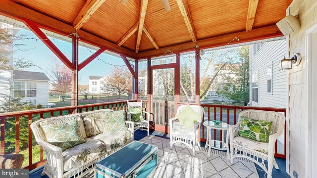 a kitchen with stainless steel appliances wooden floor dining table and chairs