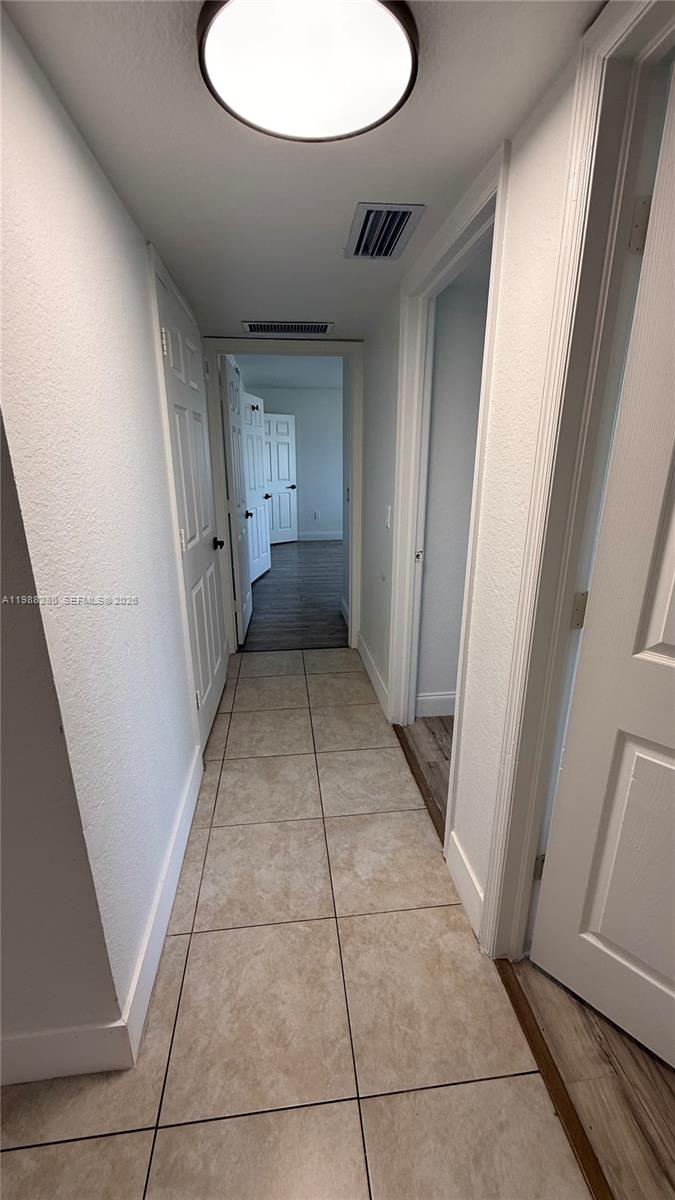 15480 Southwest 284th Street, Unit 2111 Homestead, FL 33033 - Photo 11 of 16 a view of a hallway in a house