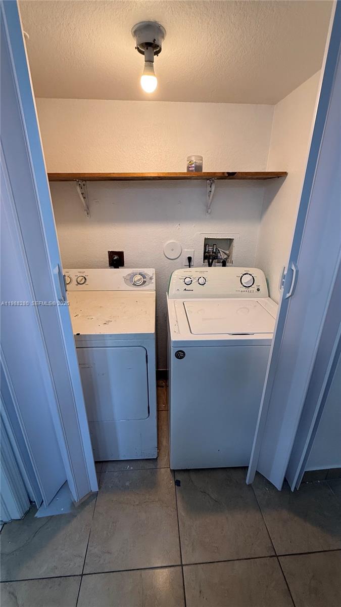 15480 Southwest 284th Street, Unit 2111 Homestead, FL 33033 - Photo 13 of 16 a utility room with dryer and washer
