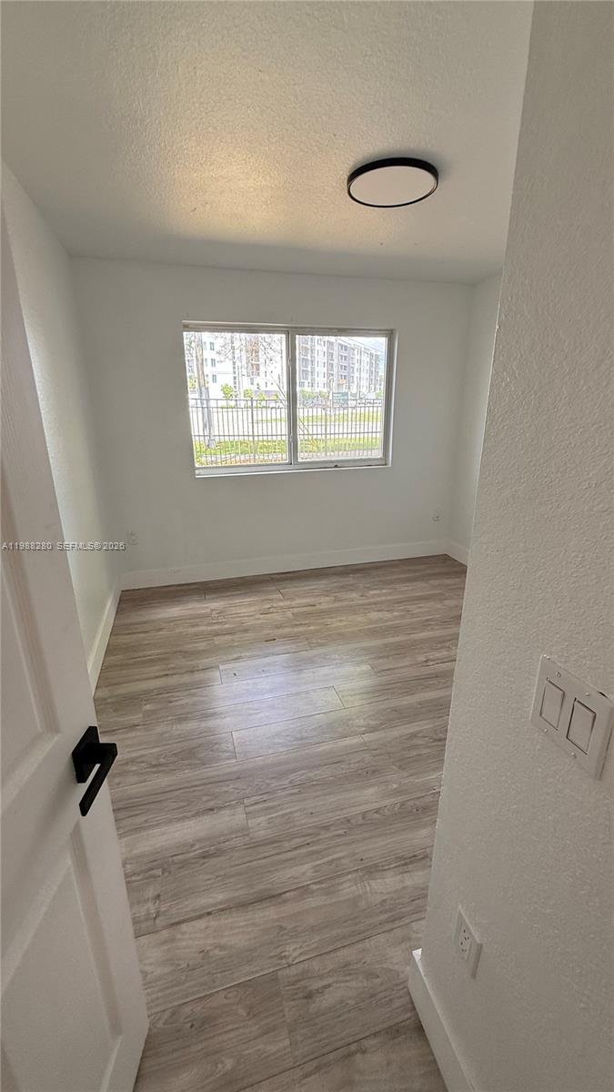 15480 Southwest 284th Street, Unit 2111 Homestead, FL 33033 - Photo 7 of 16 a view of an empty room with a window