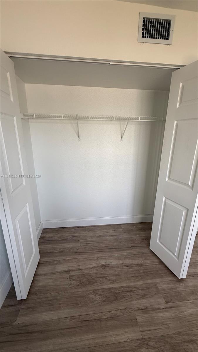 15480 Southwest 284th Street, Unit 2111 Homestead, FL 33033 - Photo 8 of 16 a view of an empty walk in closet