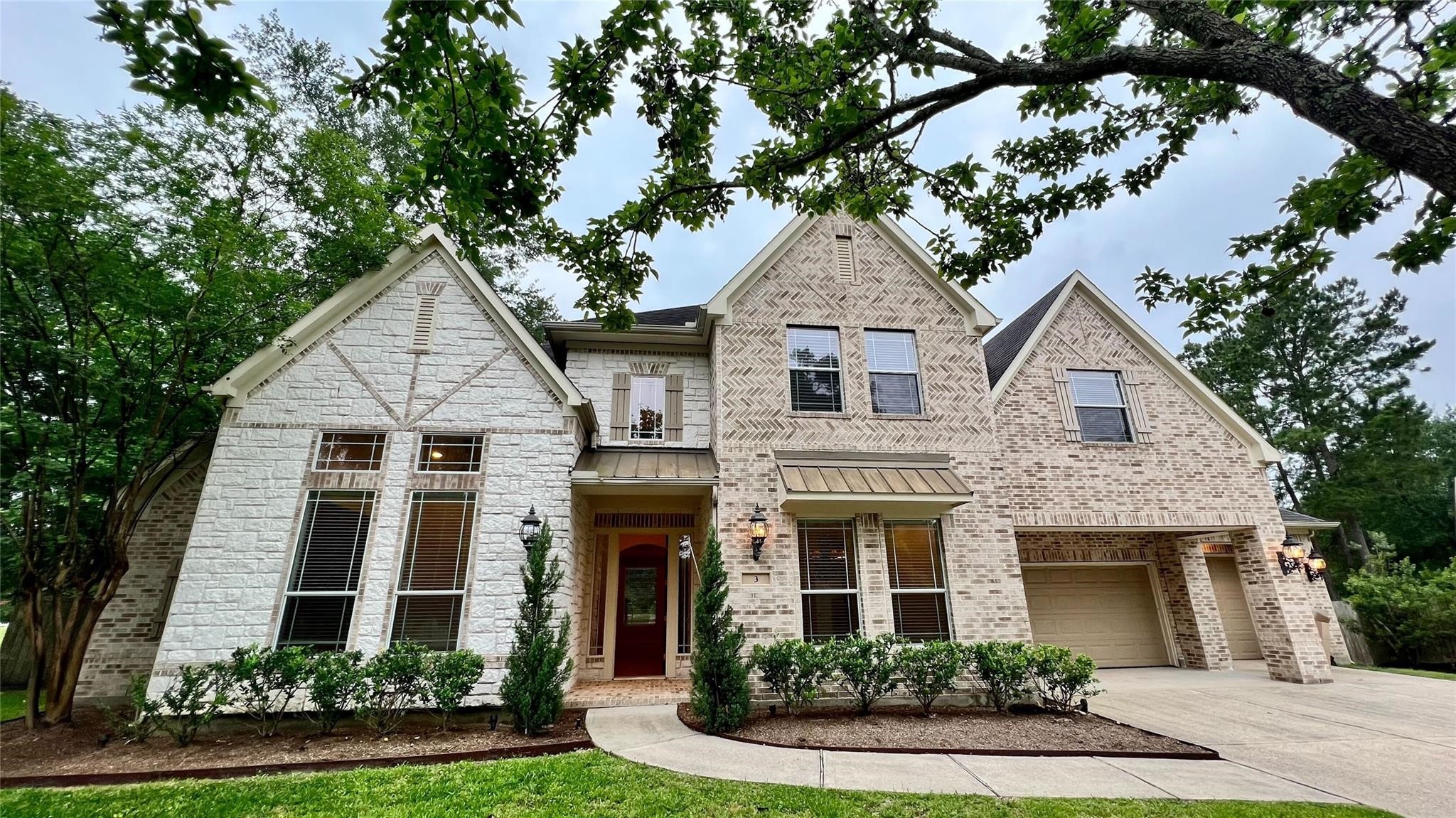 3 Etude Court Spring, TX 77382 - Photo 1 of 45 a front view of a house with garden
