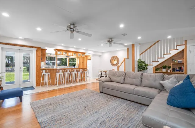 a large kitchen with stainless steel appliances granite countertop a sink and cabinets