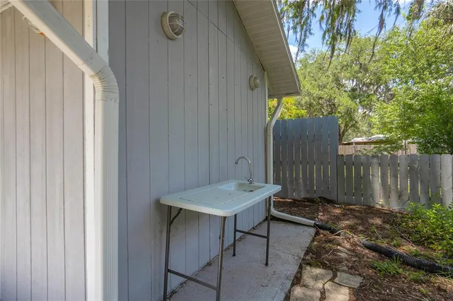 a kitchen with a sink and a refrigerator