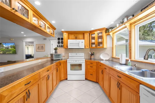 a view of a room with wooden floor and bathroom