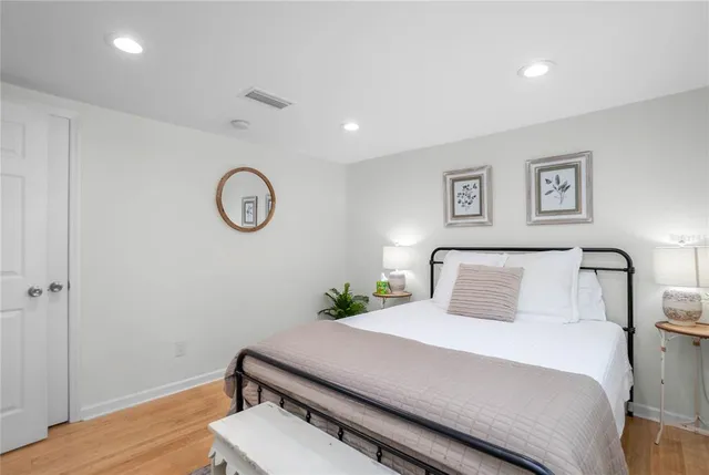 a living room with furniture a rug and a flat screen tv