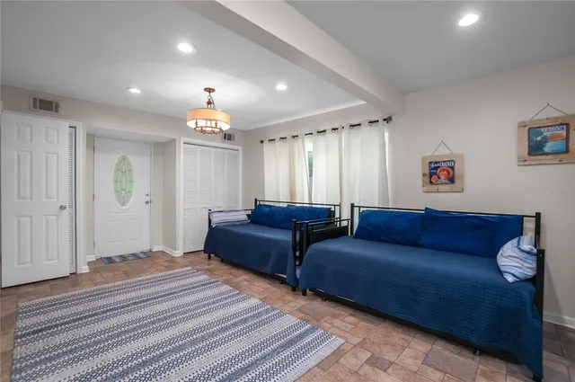 a bedroom with a large bed and a window