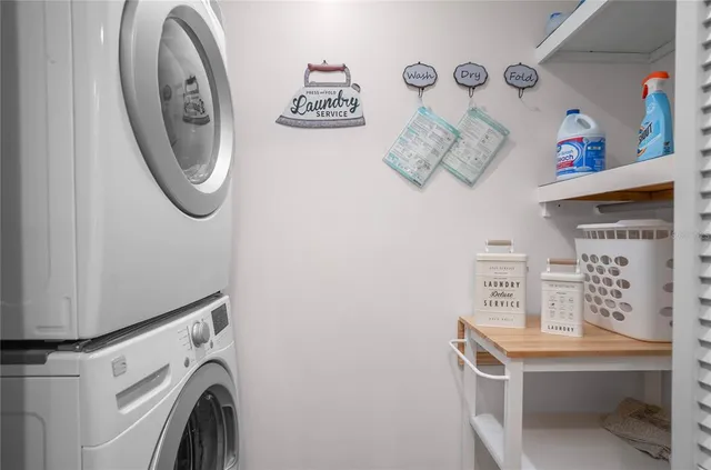 a bedroom with a bed and a potted plant