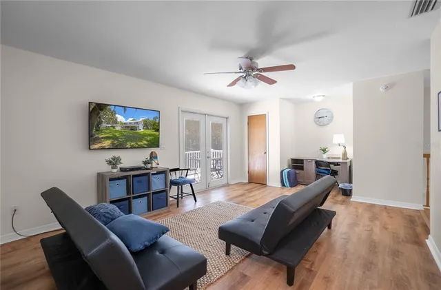 a balcony with table and chairs