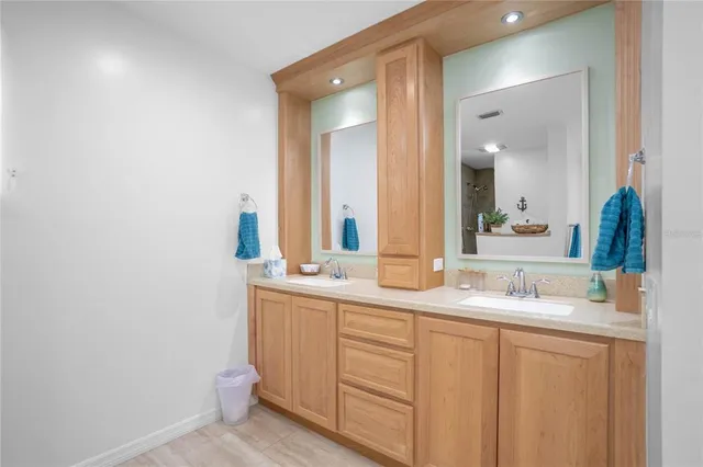 a view of a lake with houses in the background